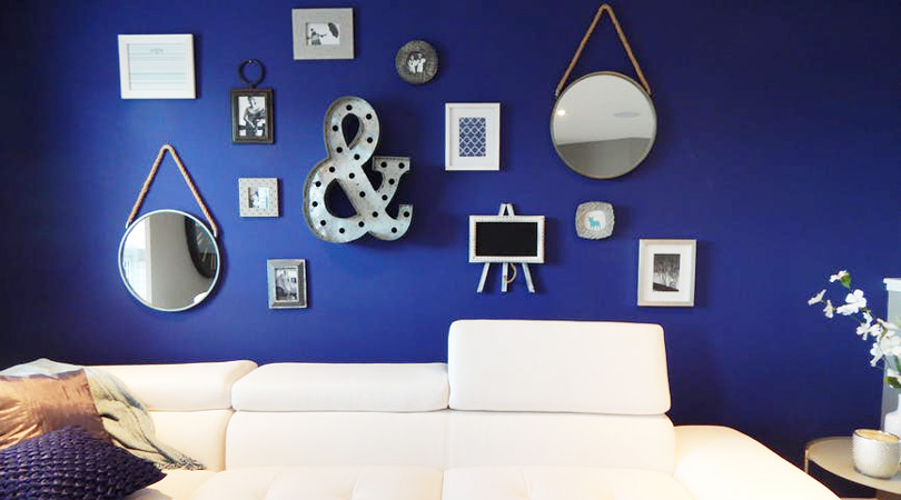 A deep blue wall with mirrors and wavy elements demonstrates a way the water element can be brought into a home - Equate Feng Shui