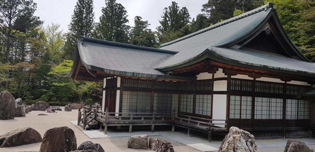 Koyasan Wakayama building Japan temple with stones on white swept sand
