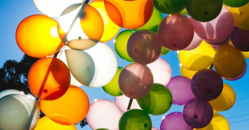 Lots of balloons on a bright sunny day