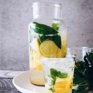How the Feng Shui Elements Affect Your Body Water Element water jug and glass with mint and lemon - Equate Feng Shui
